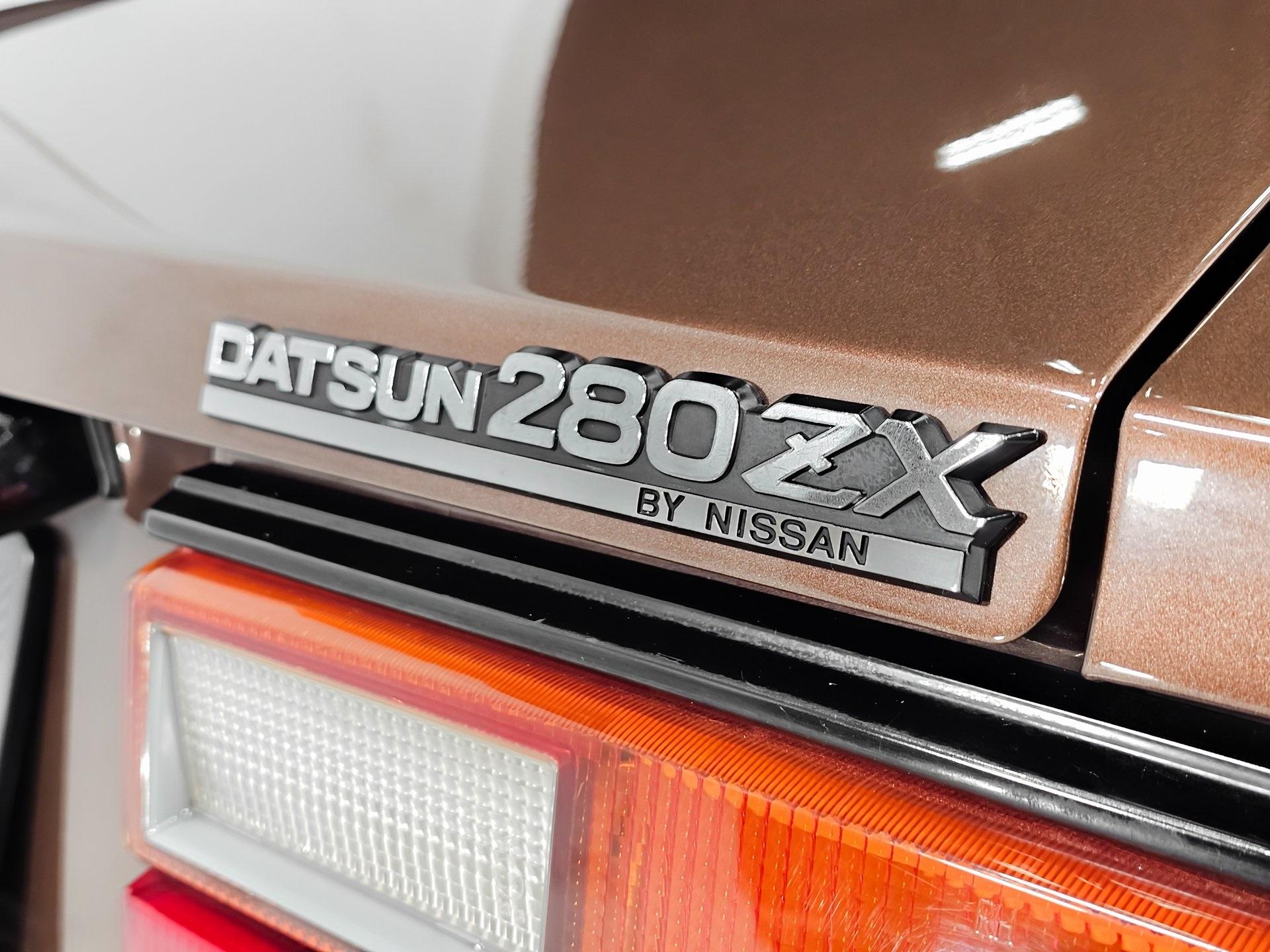 Used 1979 Datsun 280ZX ORIGINAL SPARE TIRE JACK AND WHEEL CHOCKS